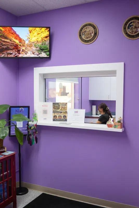 Reception window where a member of the Karma Doctors team greets arriving patients